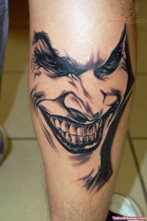 Grey Ink Happy Joker Face Tattoo