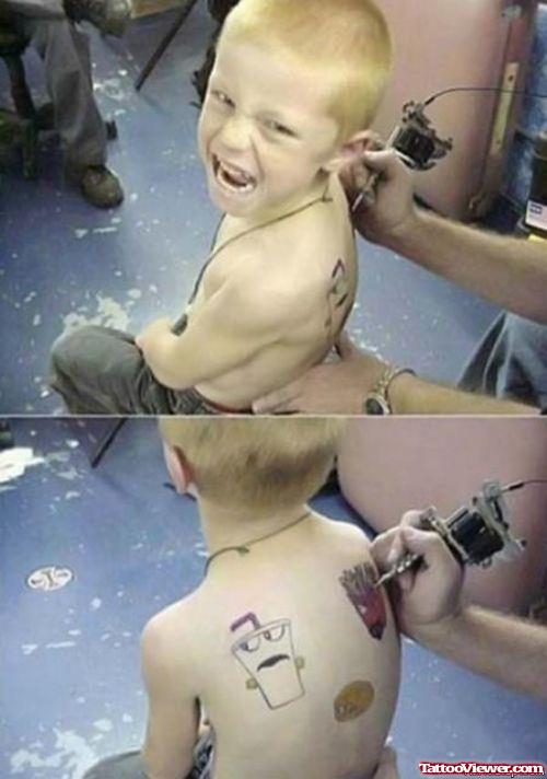 Funny Face Tattoos On Boy Back