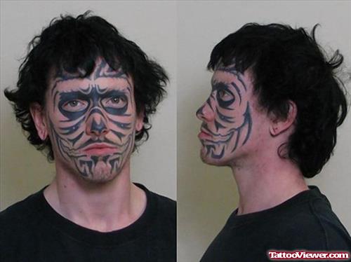 Unique Black Ink Tribal Face Tattoo