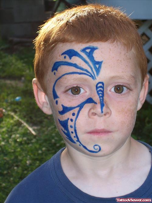 Blue Ink Boy Face Tattoo