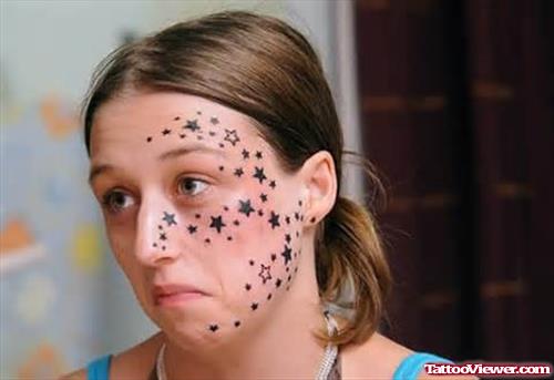 Attractive Black Ink Stars Face Tattoo