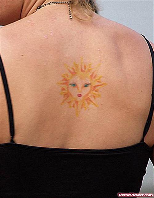 Sun Face Tattoo On Upperback