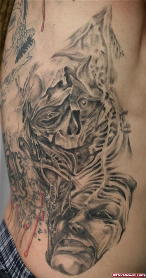Rib Side Skull And Face Mask Tattoo