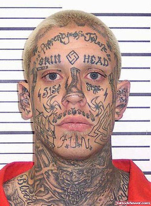 Tribal And Lettering Face Tattoo