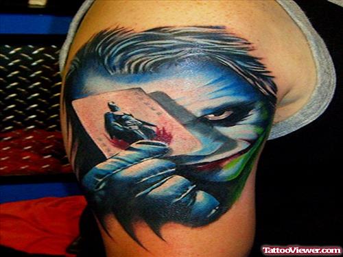 Colored Ink Joker Face Tattoo On Shoulder