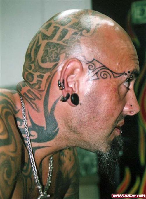 Awful Black Ink Tribal Face Tattoo