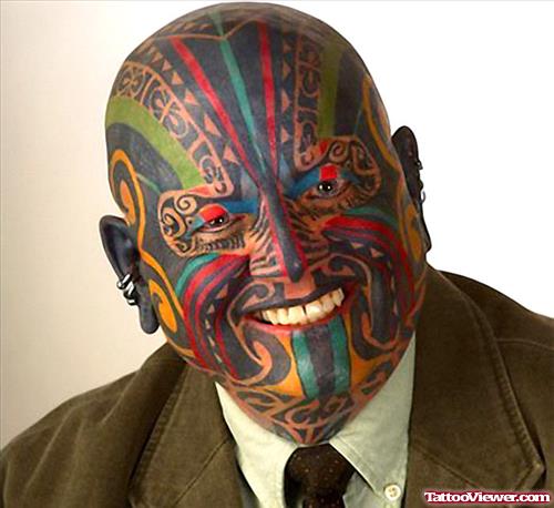 Amazing Smiling Man With Colored Face Tattoo