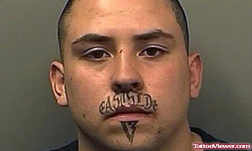 Awful East Side Face Tattoo For Men