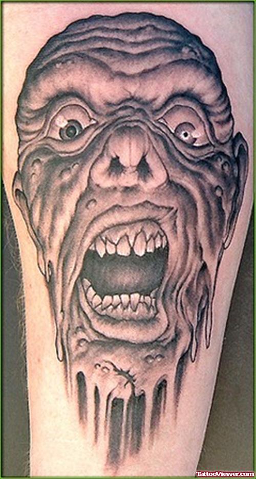 Grey Ink Melting Zombie Face Tattoo