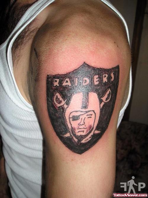 Black Ink Raider Face Tattoo On Left Shoulder