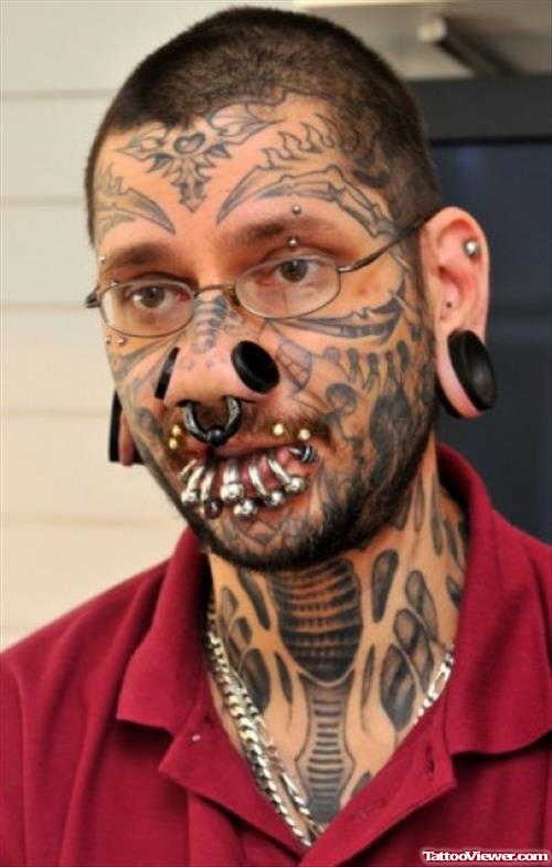 Awful Grey Ink Tribal Face Tattoo For Men