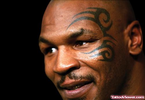 Celebrity With Tribal Face Tattoo