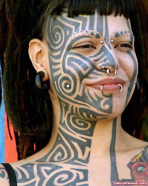 Awesome Black Ink Tribal Face Tattoo For Women