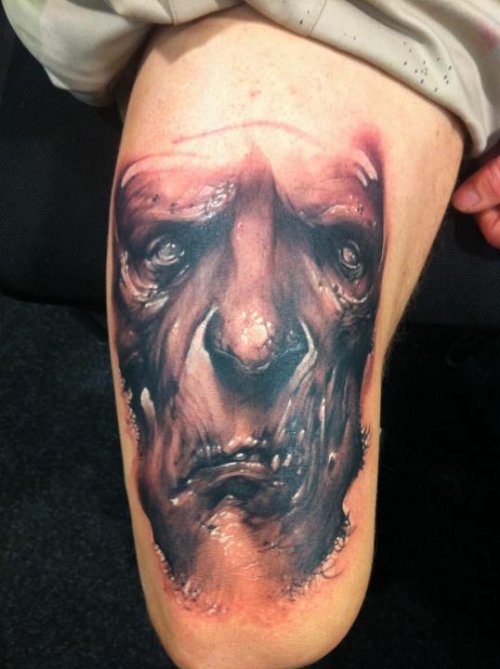 Grey Ink Evil Face Tattoo
