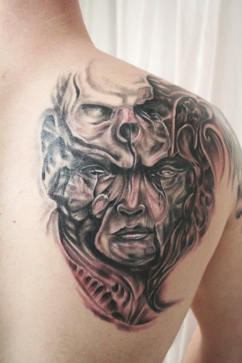 Grey Ink Scary Face Tattoo On Right Back Shoulder