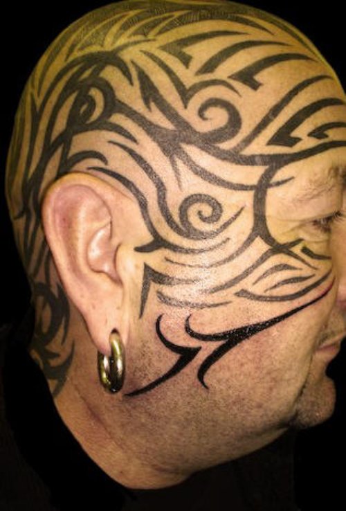 Amazing Black Ink Tribal Face Tattoo For Men