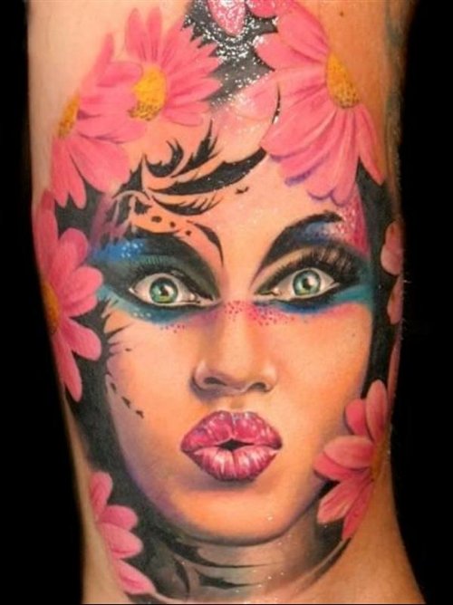 Pink Flowers And Women Face Tattoo