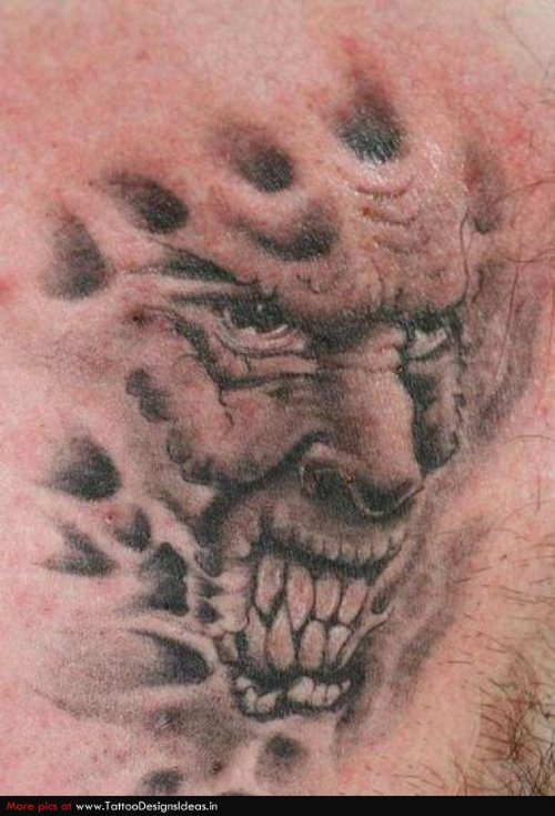 Grey Ink Demon Face Tattoo