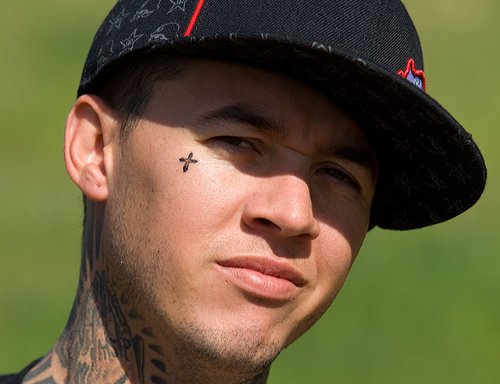 Tiny Cross Face Tattoo For Men