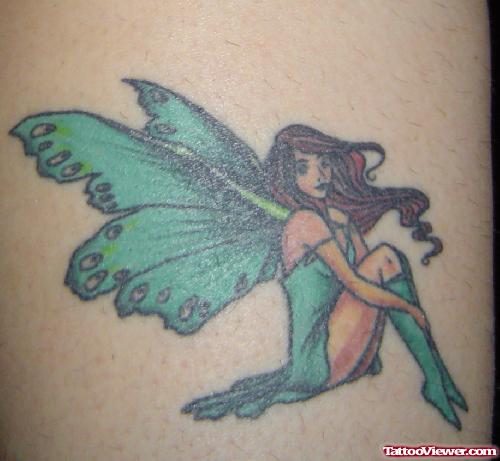 Green Ink Fairy Tattoo On Back