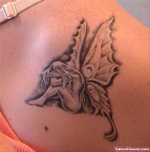Grey Ink Mushroom Fairy Tattoo On Shoulder