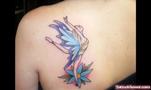Blue Flower And Dancing Fairy Tattoo On Back Shoulder