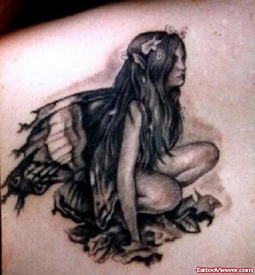 Small Grey Ink Fairy Tattoo