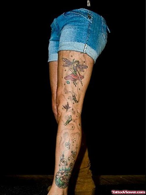 Colored Ink Fairy Tattoo On Left Leg