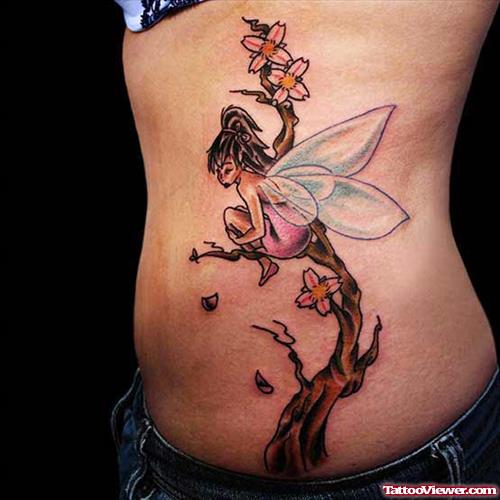 Side Rib Flower Tree And Fairy Tattoo