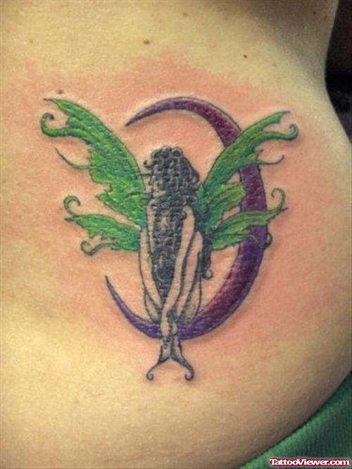 Purple Moon And Fairy Sitting Tattoo
