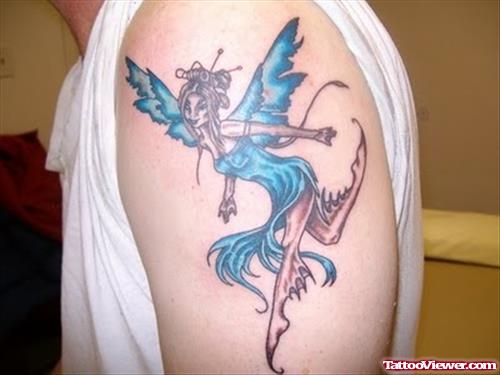 Blue Dress Fairy Tattoo On Left Shoulder