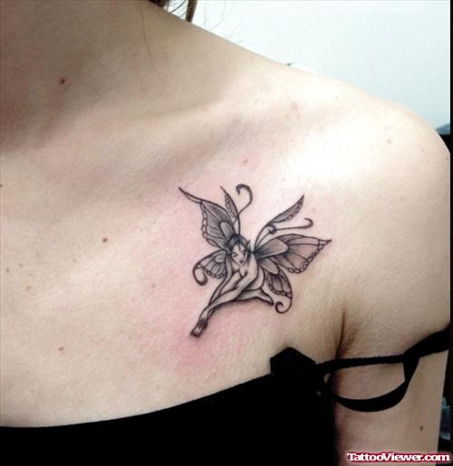 Amazing Grey Ink Fairy Tattoo On Girl Collarbone
