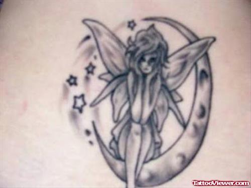 Grey Ink Moon And Fairy Tattoo