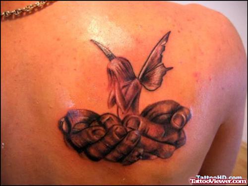 Fairy In Hands Tattoo On Back Shoulder