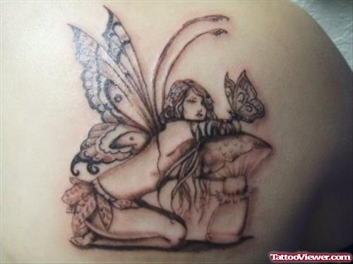 Grey Ink Butterfly And Fairy Tattoo