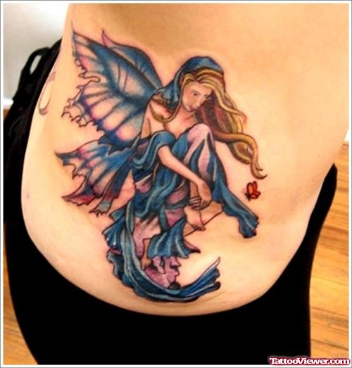 Blue Ink Fairy Tattoo On Rib Side
