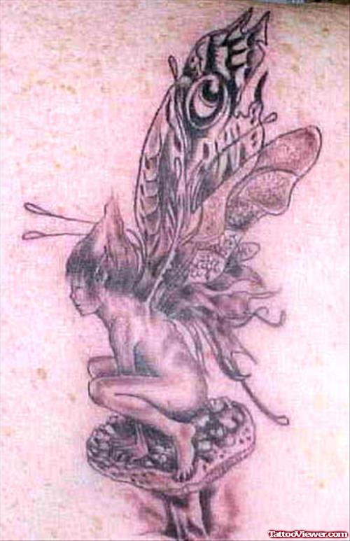 Awesome Grey Ink Mushroom And Fairy Tattoo