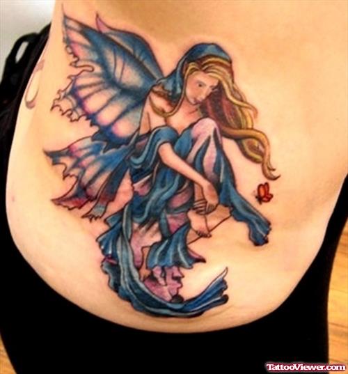 Blue Ink Beautiful Colored Fairy Tattoo
