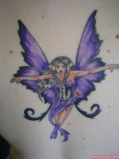 Attractive Purple Ink Fairy Tattoo On Back