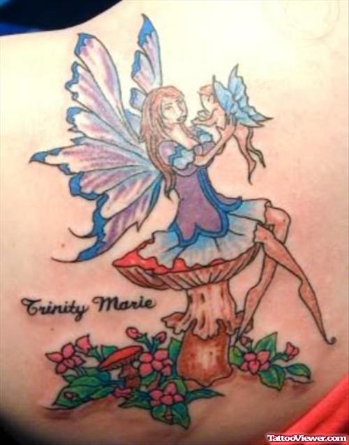 Colored Flowers And Fairy Sitting On Mushroom Tattoo