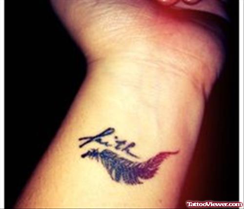 Grey Ink Feather And Faith Tattoo On Left Forearm