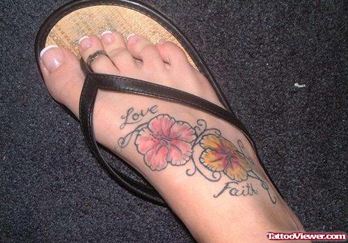 Colored Flowers And Love Faith Tattoo On Right foot