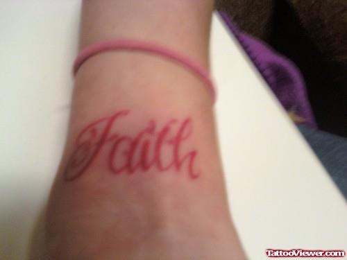 Red Ink Faith Tattoo On Arm