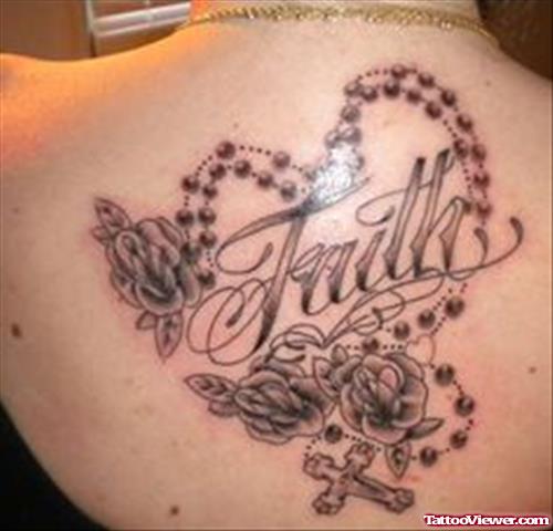 Grey Ink Rose Flowers And Faith Tattoo On Back