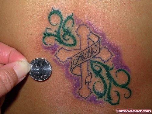 Green Ink Tribal And Cross With Faith Banner Tattoo