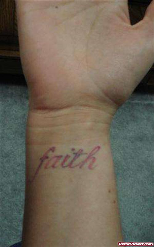 Red Ink Faith Tattoo On Wrist