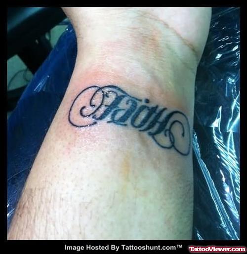 Black Ink Ambigram Faith Tattoo On Wrist
