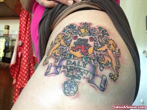 Girl Showing Family Crest Tattoo