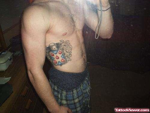 Family Crest Tattoo On Man Right Side Rib