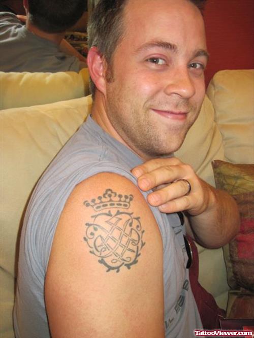 Man Showing His Family Crest Tattoo